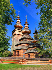 Beautiful ancient greek catholic wooden church in village of Kwiaton in summer, inscribed on the UNESCO World Heritage list, Low Beskids (Beskid Niski), Poland