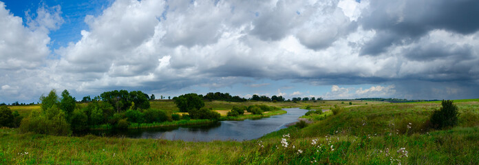 landscape with river and cloudy sky