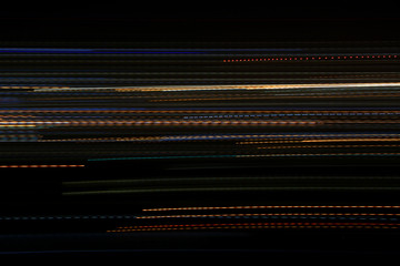 graphic design lines long exposure of lights creating straight, wavy and dotted colorful lines pattern