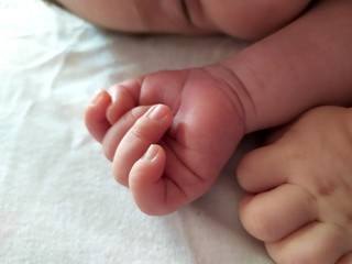 The hands of a sleeping baby