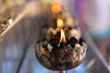 Flame in temple at Thailand.