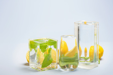 Foods distorted through liquid and glass on blue background.