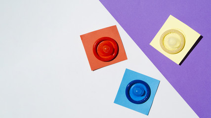 Flat lay arrangement with colourful condoms