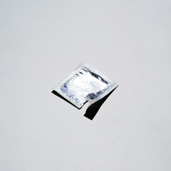 High angle condom wrapper on white background