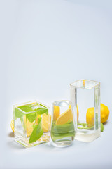 Foods distorted through liquid and glass on blue background.