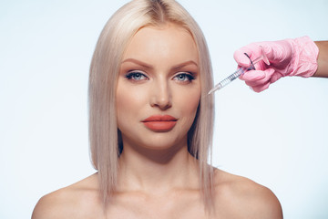 Naklejka premium Portrait of young Caucasian woman. Concept of botox cosmetic injection