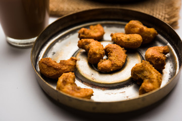 Kaju Pakoda/pakora OR Cashew Nut Fritters or bhajji, is a tasty snack from India, served as Chakna