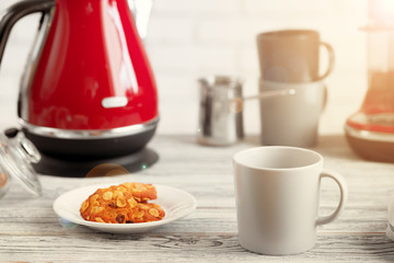 Cup of tea or coffee on modern kitchen background