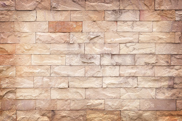 old brown slate wall stone background or texture.