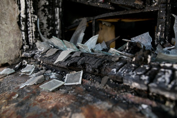 Burned interiors of industrial or residential building. Fire consequences concept.