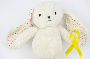 Top view teddy bear with golden ribbon