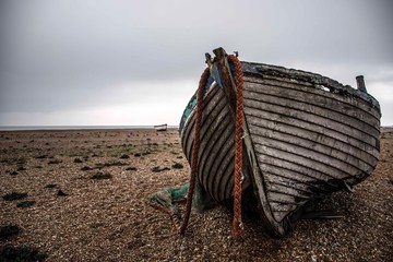 An abandoned fishing boat on Dungeness Beach