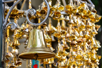 Fototapeta na wymiar Gold Bell of temple in Thailand, The bell is associated with Buddhism in Thailand