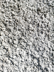 Concrete chips on the wall as abstract background