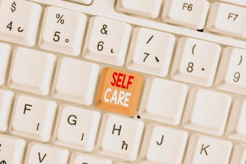 Writing note showing Self Care. Business concept for the practice of taking action to improve one s...