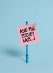 Handwriting text And The Survey Says. Conceptual photo written spoken results of short quiz or exam...