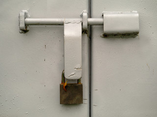 Metal lock system on a metal door. Concept safety, protection,