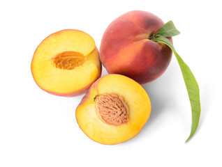 Ripe peaches on white background