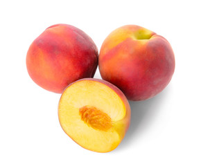 Ripe peaches on white background