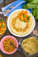 Original homemade arabic chickpea hummus with olive oil and cumin. Creamy dip paste.