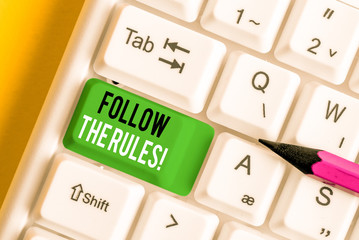 Writing note showing Follow The Rules. Business concept for go with regulations governing conduct...