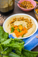 Original homemade arabic chickpea hummus with olive oil and cumin. Creamy dip paste.