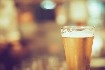 cold beer on counter bar, retro tone
