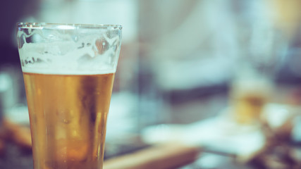 cold beer on counter bar, retro tone
