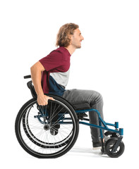 Naklejka premium Handsome man in wheelchair on white background