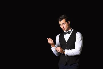Stylish fashionable man on dark background