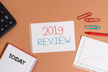 Writing note showing 2019 Review. Business concept for New trends and prospects in tourism or services for 2019 Cardboard notebook office study supplies chart paper