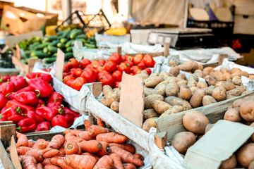 Assortment of fresh vegetables on counter at market