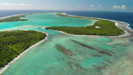 Aerial view descending towards Nikumororo atoll in Kiribati