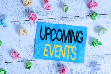 Word writing text Upcoming Events. Business photo showcasing the approaching planned public or social occasions Crumpled colored rectangle square shaped paper reminder white wood desk
