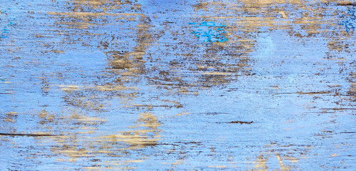 Old grunge rustic wooden texture background with blue color cracked weathered paint and scratches