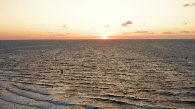 Kitesurfers near the beach of Domburg during sunset. Aerial shot.
