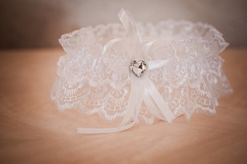 White color garter lying on the wooden table