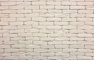 Close-up of white painted whitewashed solid brick wall. Abstract copy space background, Bricklaying, construction and masonry concept.