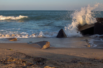 September impression. Stormy sea in the light of sunset. Fisherman's Beach, Byala Resort, Black Sea, Bulgaria.
