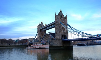 Boat passing under Tower Bridge