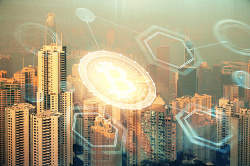 Double exposure of crypto currency theme hologram drawing and city veiw background. Concept of...