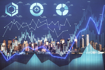 Financial graph on night city scape with tall buildings background double exposure. Analysis concept.