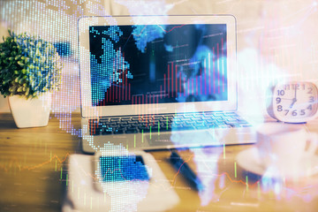 Financial graph colorful drawing and table with computer on background. Double exposure. Concept of international markets.