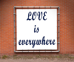 Large message written on a wall - Love is everywhere