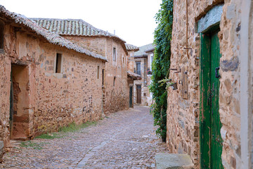 Fototapeta na wymiar Street of the medieval village of Castrillo de los Polvazares. Province of Leon. Spain