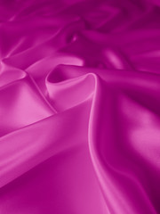 Beautiful smooth elegant wavy hot pink satin silk luxury cloth fabric texture, abstract background design. 