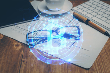 Crypto theme hologram with glasses on the table background. Concept of blockchain. Double exposure.