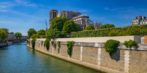 Fototapeta na wymiar Notre Dame de Paris reconstruction, scaffoldings and work in progress after the fire destroyed the cathedral on 15 April 2019