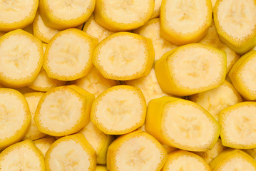 Fresh banana slices background. Top view.