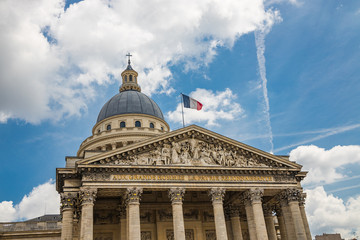 The Pantheon building in the Latin Quarter in Paris France with french flags waving on the famous monument during Bastille Day